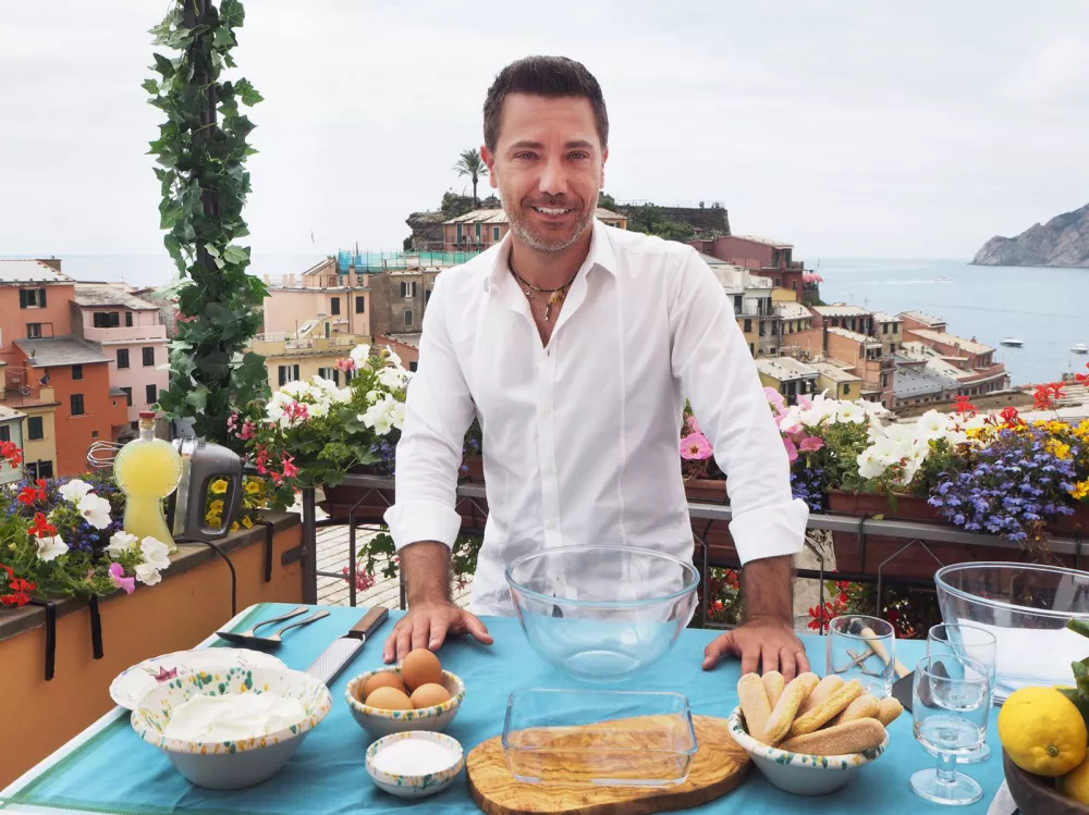 Gino D'Acampo prepares a tiramisu with a twist - using lemons and limoncello in the vineyards of Vernazza, Northern Italy'Ginos Italian Express' TV Show, Series 1, Episode 3 UK - 05 Dec 2019Ginos Italian Express, is a British ITV documentary series in which Gino D'Acampo, an Italian celebrity chef and media personality based in the United Kingdom, tours his home country of Italy, this time experiencing by travelling on Italy's railways. In this episode he visits the Cinque Terre were these five breathtaking towns cling to the cliff edges. He stops at Corniglia to meet an opera singing florist, Manarola, were Gino makes a Minestrone soup, before heading to Vernazza to meet wine producers Bartolo and Lisse who scale 1000 meters above sea level to tend to their vines.,Image: 483003292, License: Rights-managed, Restrictions: Editorial use only, Model Release: no / Foto: Profimedia