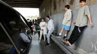 People take shelter under the bridge of a highway after Israel's military announced they identified missiles launched from Iran towards Israel and sirens are sounded, near Latrun, Israel, February 28, 2026. REUTERS/Amir Cohen