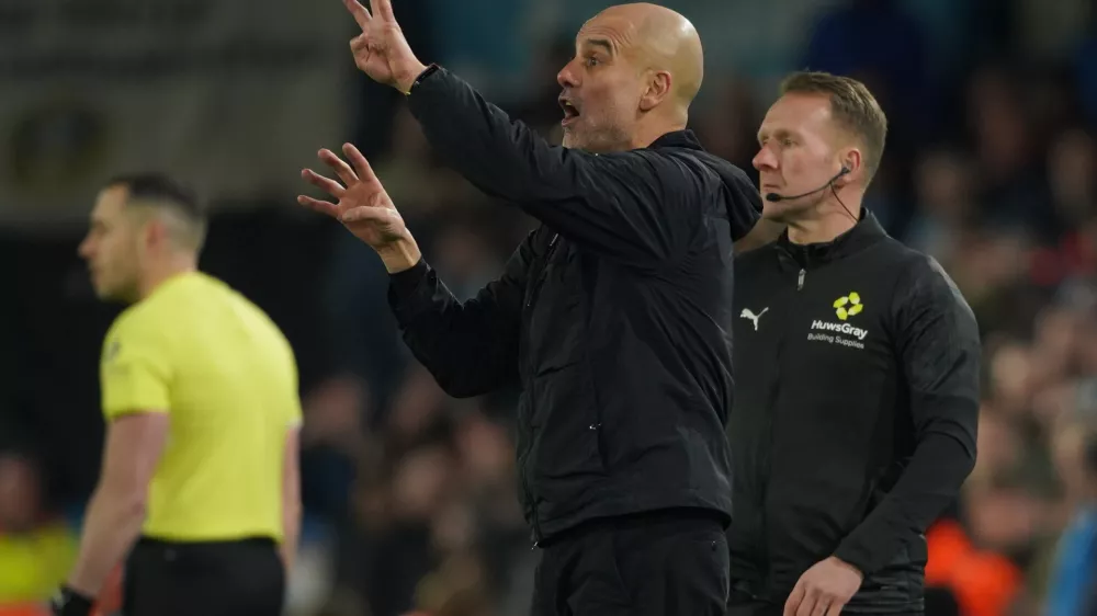 Manchester City's head coach Pep Guardiola reacts during the Premier League soccer match between Leeds United and Manchester City in Leeds, England, Saturday, Feb. 28, 2026. (AP Photo/Ian Hodgson)