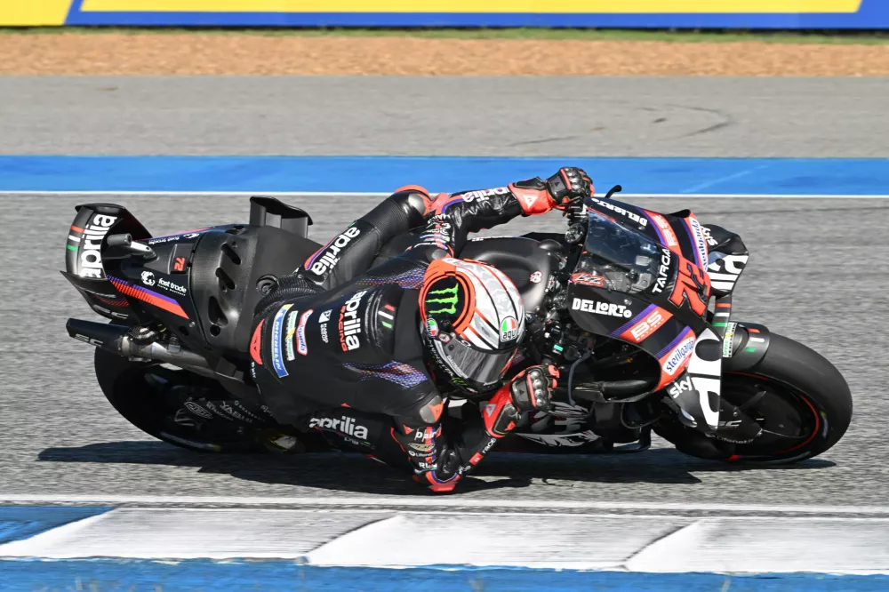 Italy's Marco Bezzecchi of Aprilia Racing steers his motorcycle during the MotoGP at the Chang International Circuit in Buriram, Thailand, Sunday, March 1, 2026. (AP Photo/Kittinun Rodsupan)
