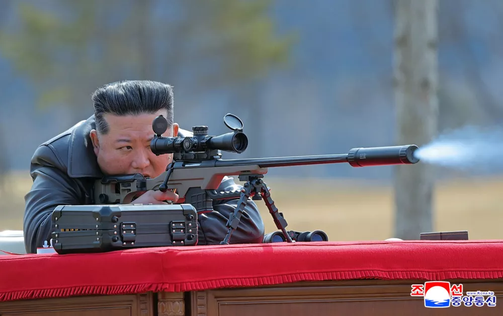In this photo provided by the North Korean government, its leader Kim Jong Un test-fires a new sniper rifle at a shooting range in an undisclosed location, North Korea Friday, Feb. 27, 2026. Independent journalists were not given access to cover the event depicted in this image distributed by the North Korean government. The content of this image is as provided and cannot be independently verified. Korean language watermark on image as provided by source reads: "KCNA" which is the abbreviation for Korean Central News Agency. (Korean Central News Agency/Korea News Service via AP)