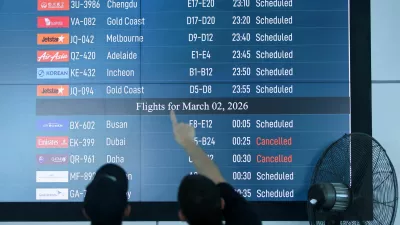 Passengers looks at departure board at I Gusti Ngurah Rai International Airport as some flights to Dubai and Doha cancelled following strikes on Iran launched by the United States and Israel, in Kuta, Bali, Indonesia, March 1, 2026. REUTERS/Johannes Christo