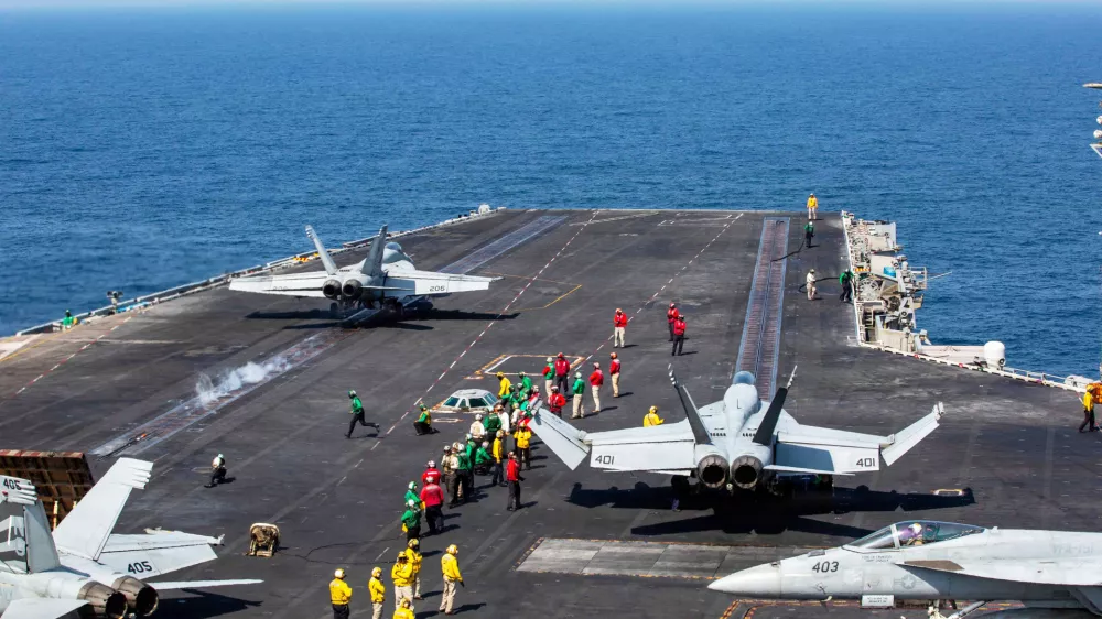 This image provided by U.S. Central Command shows a F/A-18E Super Hornet launching at left, as an F/A-18E Super at right, prepares to launch from the flight deck of Nimitz-class aircraft carrier USS Abraham Lincoln (CVN 72) in support of Operation Epic Fury, on Saturday, Feb. 28, 2026. (U.S. Navy via AP)