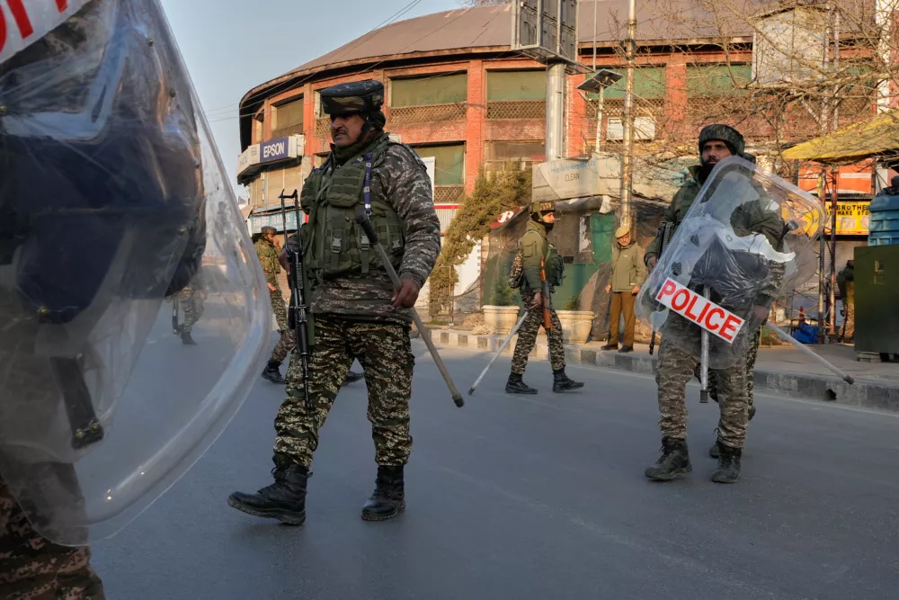 Indian paramilitary soldiers patrol as authorities impose restrictions after protests erupted against the killing of Iran's Supreme Leader Ayatollah Ali Khamenei, in Srinagar, Indian controlled Kashmir Monday, March 2, 2026. (AP Photo/Mukhtar Khan)
