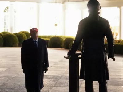 U.S. President Donald Trump looks at a newly installed statue of Thomas Jefferson, on returning to the White House, after Israel and the U.S. launched strikes on Iran, in Washington, D.C., U.S., March 1, 2026. REUTERS/Nathan Howard