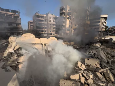 Smoke rises from a destroyed building that was hit by an Israeli airstrike in Dahiyeh, a southern suburb of Beirut, Lebanon, Tuesday, March 3, 2026. (AP Photo/Hussein Malla)