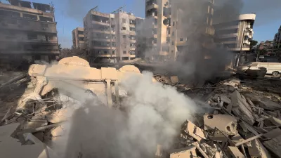 Smoke rises from a destroyed building that was hit by an Israeli airstrike in Dahiyeh, a southern suburb of Beirut, Lebanon, Tuesday, March 3, 2026. (AP Photo/Hussein Malla)