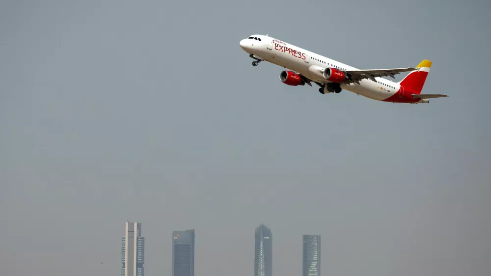 FILE PHOTO: An Iberia Express Airbus A321-200 airplane takes off from the Adolfo Suarez Madrid-Barajas airport as seen from Paracuellos del Jarama, outside Madrid, Spain, August 8, 2018. REUTERS/Paul Hanna/File Photo