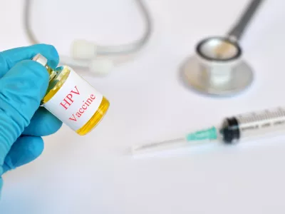 Bottle of HPV vaccine with syringe