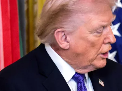 FILE PHOTO: A patch of blemished skin is visible over U.S. President Donald Trump's shirt collar during a Medal of Honor ceremony at the White House in Washington, D.C., U.S., March 2, 2026. REUTERS/Jonathan Ernst/File Photo