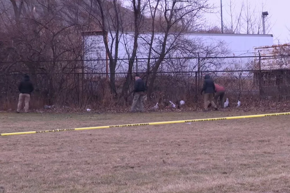 This image made from video provided by WEWS/News 5 shows authorities examining a crime scene where the bodies of two young girls were found buried in suitcases, Tuesday, March 3, 2026, in Cleveland. (WEWS/News 5 via AP)