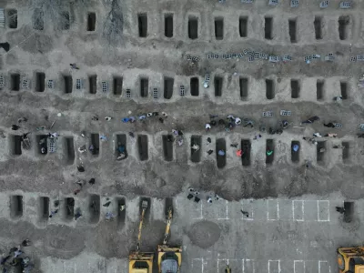 Graves are being prepared for the victims following a reported strike on a school in Minab, Iran, March 2, 2026. Iranian Foreign Media Department/WANA (West Asia News Agency)/Handout via REUTERS ATTENTION EDITORS - THIS PICTURE WAS PROVIDED BY A THIRD PARTY. REFILE &ndash; REMOVING ATTRIBUTION TO STRIKE