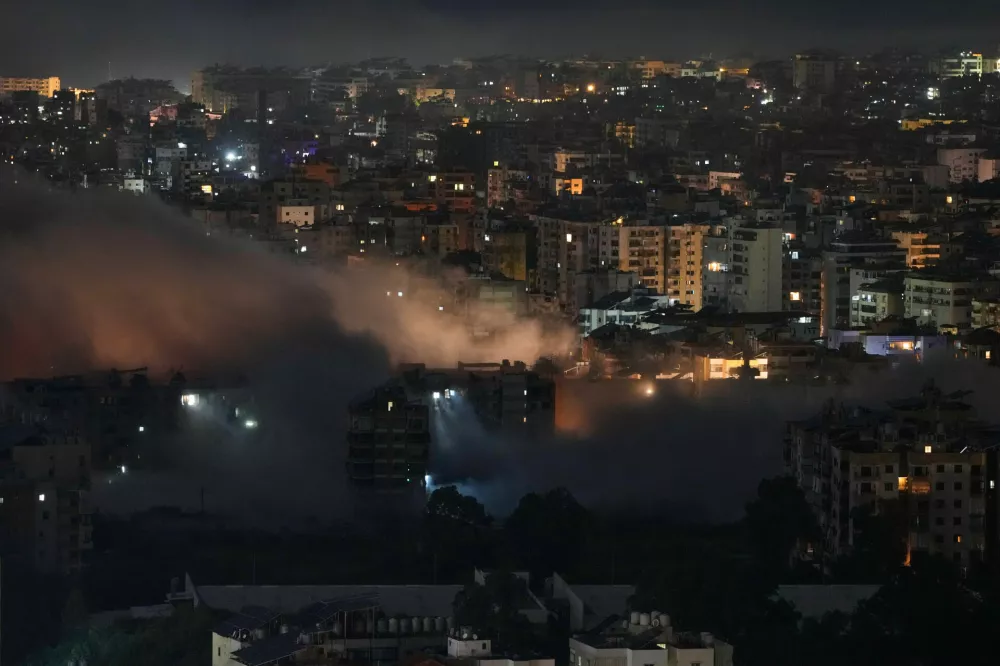 Smoke rises following Israeli airstrikes in Dahiyeh, Beirut's southern suburbs, Lebanon, early Friday, March 6, 2026. (AP Photo/Hassan Ammar)
