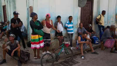 People wait their turn to buy bread during a blackout in Havana, Cuba, Thursday, March 5, 2026. (AP Photo/Ramon Espinosa)
