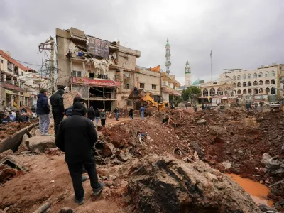 People inspect the damage where Israel's military carried out an airborne operation that dropped troops overnight, in the town of Nabi Chit, Lebanon, March 7, 2026. REUTERS/ Mohammad Yassine