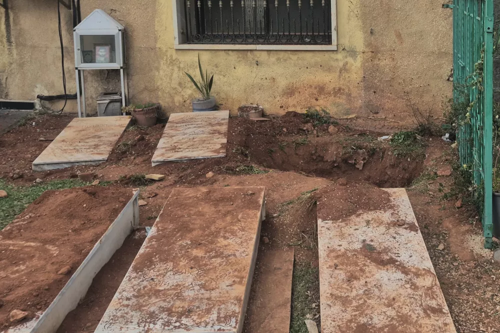 A grave, background, dug by Israeli forces landed overnight late Friday, searching for Israeli co-pilot Ron Arad who was captured and then went missing after his fighter jet crashed over south Lebanon in 1986, in Nabi Chit village, eastern Lebanon, Saturday, March 7, 2026. (AP Photo/Ali Salem)