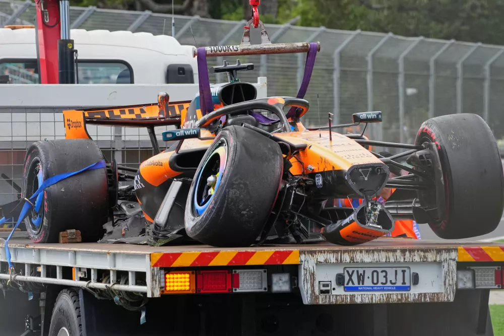 McLaren driver Oscar Piastri of Australia's car is taken from the track track after he crashed during the formation lap ahead of the Australian Formula One Grand Prix at Albert Park, in Melbourne, Australia, Sunday, March 8, 2026. (AP Photo/Scott Barbour)