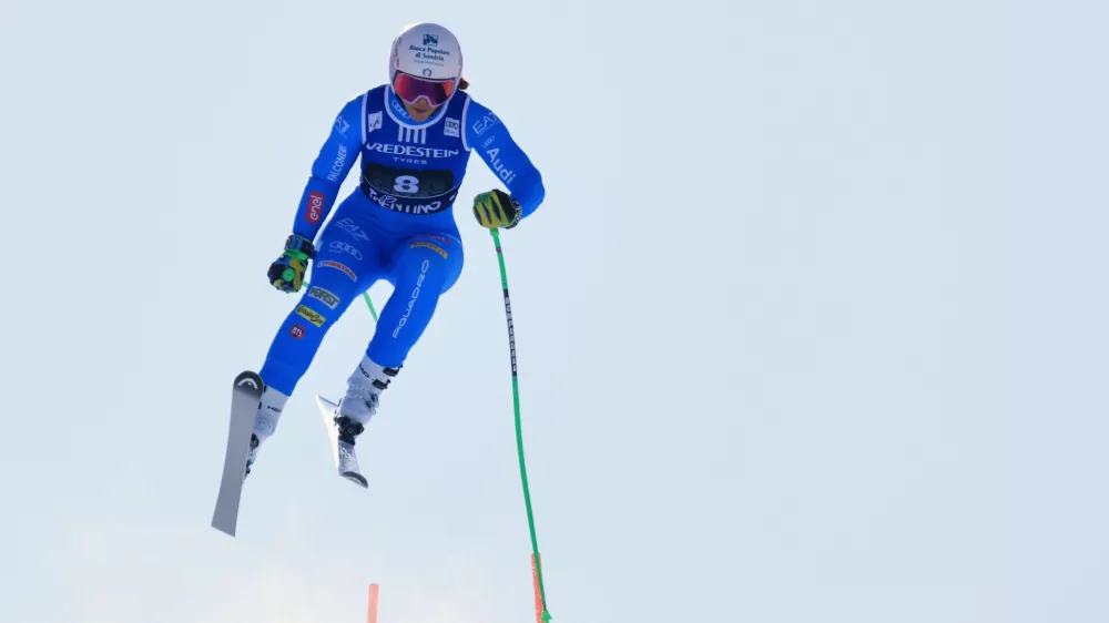 Italy's Elena Curtoni is airborne during an alpine ski, women's World Cup super-G, in Val di Fassa, Italy, Sunday, March 8, 2026. (AP Photo/Luciano Bisi)