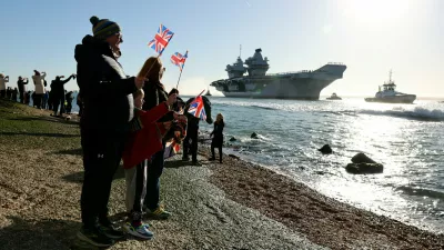 People gather to watch HMS Prince of Wales return home to Portsmouth, following an eight-month Indo-Pacific deployment as part of Operation Highmast, in Portsmouth, Britain November 30, 2025. UK MOD Crown/Ollie Leach/Handout via REUTERS THIS IMAGE HAS BEEN SUPPLIED BY A THIRD PARTY