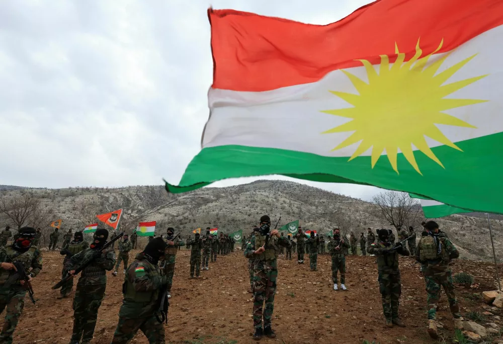 FILE PHOTO: Iranian Kurdish fighters from the Kurdistan Freedom Party (PAK) take part in a training session at a base on the outskirts of Erbil, Iraq February 12, 2026. REUTERS/Thaier Al-Sudani/File Photo