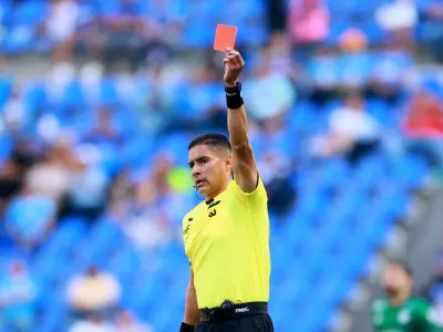 Soccer Football - Liga MX - Cruz Azul v Atletico San Luis - Estadio Cuauhtemoc, Puebla, Mexico - March 7, 2026 Referee Vicente Jassiel Reynoso Arce shows a red card to Atletico San Luis' Eduardo Aguila REUTERS/Eloisa Sanchez