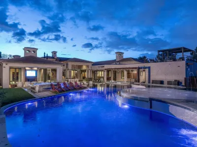 EXCLUSIVE: Story from Jam Press (Mega Bungalow Sale)Mega bungalow with own go-kart track and luxury man cave goes on sale for whopping Ł15mA jaw-dropping mega bungalow complete with its own go-kart track, underground shooting range and luxury man cave has hit the market for a staggering Ł15million.The eye-watering ranch-style pad boasts seven bedrooms and nine bathrooms &ndash; all spread across a sprawling 24,000 square feet of land.Described as the "ultimate sports and entertainment complex", the one-storey mansion is a playground for the super-rich.Built 23 years ago, the property comes with a six-car garage, a private cinema and even its own swimming pool.And if that wasn't enough, thrill-seekers can enjoy an underground shooting range and race mates on a private go-kart track.The mega-home is located in Gilbert, Maricopa County, Arizona, as reported by&nbsp;Luxury Property News.The lavish listing reads: "The main house has 9,326 square-feet of elegant living space with a six-stall garage and private movie theatre."The Hideaway Man Cave has 6,610 square-feet of entertainment/relaxation with a commercial kitchen, golf simulator, dance studio, batting cage, full fitness room and a studio apartment."The private day spa has 5,660 square-feet featuring a massage room, his-and-hers bathrooms, yoga room, hidden guest suite, dry sauna, steam room, spa shower and hot tub."The Go-Kart track is complete with six electric go-karts for endless outdoor fun."The underground shooting range has a two-lane, 185 foot-long gun range with a walk-in armoury."There is a Zen garden or greenhouse with perfectly manicured spaces for peace and tranquility."And an exotic animal enclosure, Koi ponds, baseball and full basketball court."The luxury estate is on sale with agents Compass for a cool 0million (Ł15million) &ndash; meaning only the deepest of pockets need apply.ENDSEDITOR'S NOTE:&nbsp;Video Usage Licence: (PROFESSIONAL.24 Feb 2026Pictured: Story from Jam Press (Mega Bungalow Sale)Mega bungalow with own go-kart track and luxury man cave goes on sale for whopping Ł15mA jaw-dropping mega bungalow complete with its own go-kart track, underground shooting range and luxury man cave has hit the market for a staggering Ł15million.The eye-watering ranch-style pad boasts seven bedrooms and nine bathrooms &ndash; all spread across a sprawling 24,000 square feet of land.Described as the "ultimate sports and entertainment complex", the one-storey mansion is a playground for the super-rich.Built 23 years ago, the property comes with a six-car garage, a private cinema and even its own swimming pool.And if that wasn't enough, thrill-seekers can enjoy an underground shooting range and race mates on a private go-kart track.The mega-home is located in Gilbert, Maricopa County, Arizona, as reported by&nbsp;Luxury Property News.The lavish listing reads: "The main house has 9,3.,Image: 1077930760, License: Rights-managed, Restrictions: NO Australia, Germany, Norway, South Korea, Sweden, United Kingdom, United States, Unknown Country, Model Release: no, Pictured: The incredible home for sale in Gilbert, Arizona