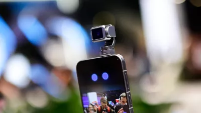 The 5 Honor Robot Phone is showcased at MWC 2026, featuring its signature motorized robotic camera arm. The device, which Honor calls a ''new species'' of smartphone, uses a self-developed micro-motor, 70% smaller than standard industry solutions, to deploy a 200MP camera on a three-axis gimbal. During the live demonstration, the robotic arm tracks subjects autonomously and responds to voice commands with human-like ''nods'' and ''shakes.'' This integration of embodied AI and mechanical motion allows the phone to perform cinematic pans, keep users perfectly centered during video calls, and even ''dance'' to music, marking a major leap in mobile videography and interactive hardware during the Mobile World Congress (MWC) in Barcelona, Spain, on March 5, 2026. (Photo by Joan Cros/NurPhoto)NO USE FRANCE