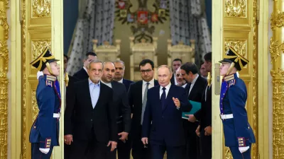FILE - Iranian President Masoud Pezeshkian, center left, and Russian President Vladimir Putin, center right, arrive at a ceremony following their talks at the Kremlin in Moscow, Russia, on Jan. 17, 2025. (Vyacheslav Prokofyev, Sputnik, Kremlin Pool Photo via AP, File)