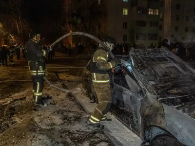Rescuers put out the fire at a residential neighbourhood following Russia's drone attack in Kharkiv, Ukraine, late Monday, March 9, 2026. (AP Photo/Andrii Marienko)