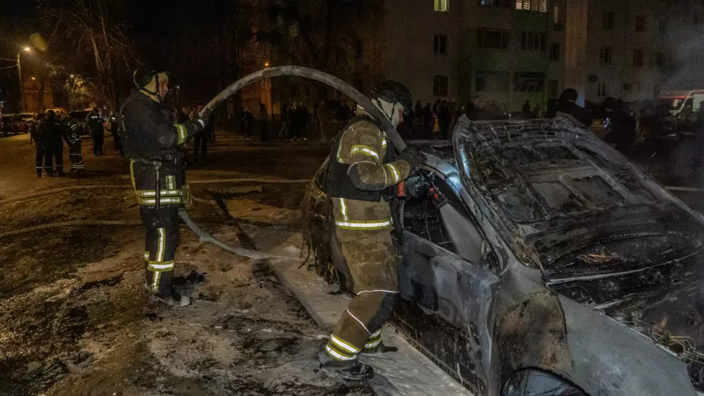 Rescuers put out the fire at a residential neighbourhood following Russia's drone attack in Kharkiv, Ukraine, late Monday, March 9, 2026. (AP Photo/Andrii Marienko)