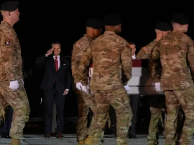 Defense Secretary Pete Hegseth salutes as an U.S. Army carry team moves the transfer case containing the remains of Sgt. Benjamin N. Pennington, 26, of Glendale, Ky., Monday March 9, 2026, at Dover Air Force Base, Del. (AP Photo/Julia Demaree Nikhinson)
