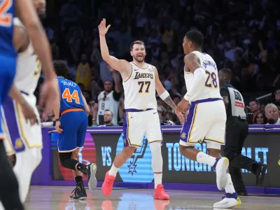 Mar 8, 2026; Los Angeles, California, USA; Los Angeles Lakers guard Luka Doncic (77) celebrates with forward Rui Hachimura (28) against the New York Knicks in the second half at Crypto.com Arena. Mandatory Credit: Kirby Lee-Imagn Images