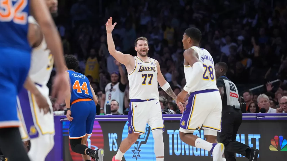 Mar 8, 2026; Los Angeles, California, USA; Los Angeles Lakers guard Luka Doncic (77) celebrates with forward Rui Hachimura (28) against the New York Knicks in the second half at Crypto.com Arena. Mandatory Credit: Kirby Lee-Imagn Images