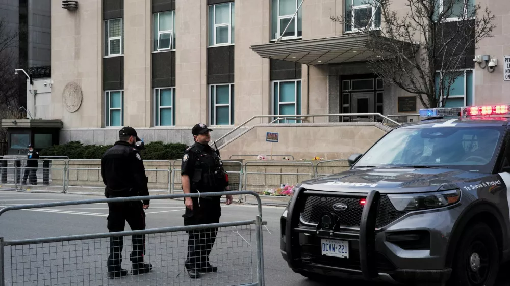 Members of the police stand guard ahead of a briefing by Deputy Chief Frank Barredo (TPS) and Chief Superintendent Chris Leather, Officer in Charge of Criminal Operations for RCMP Ontario, held at 360 University Avenue, providing an update regarding the firearm discharge that occurred at the U.S. Consulate, in Toronto, Ontario, Canada March 10, 2026. REUTERS/Wa Lone