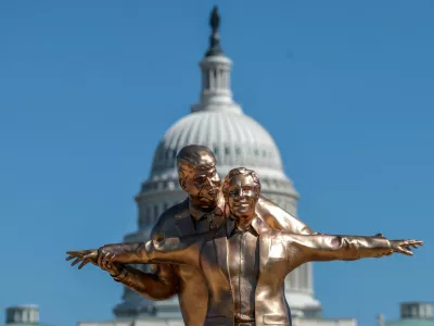 People look at a statue depicting U.S. President Donald Trump and convicted sex offender Jeffrey Epstein, entitled "The King of the World", on the National Mall in Washington, D.C., U.S., March 10, 2026. REUTERS/Evelyn Hockstein   TPX IMAGES OF THE DAY