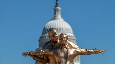 People look at a statue depicting U.S. President Donald Trump and convicted sex offender Jeffrey Epstein, entitled "The King of the World", on the National Mall in Washington, D.C., U.S., March 10, 2026. REUTERS/Evelyn Hockstein   TPX IMAGES OF THE DAY