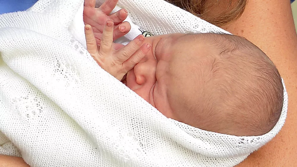 File - In this Tuesday, July 23, 2013 file photo, Kate, the Duchess of Cambridge, carries her new born son, the Prince of Cambridge, who was born on Monday. into public view for the first time. outside the Lindo Wing of St. Mary's Hospital, in London. Royal officials say Britain's new prince has been named George Alexander Louis. Palace officials said Wednesday, July 24, 2013, that the 2-day-old baby and third-in-line to the throne will be known as His Royal Highness Prince George of Cambridge. (AP Photo/John Stillwell, Pool, File)