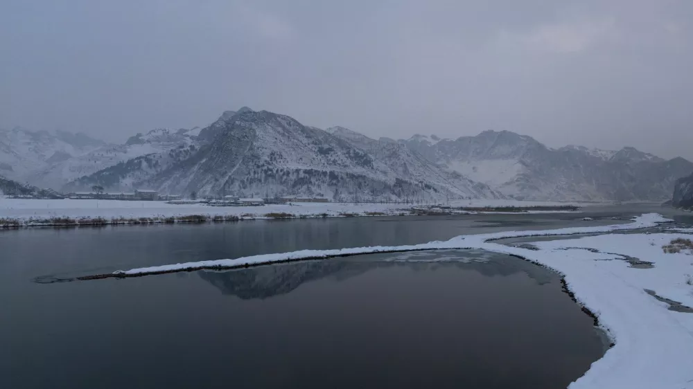 Munak railway station in North Korea is seen across the Yalu River from a tourist viewing platform in Jian, Jilin province, China, January 15, 2026. REUTERS/Maxim Shemetov