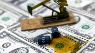 FILE PHOTO: Oil, miniatures of oil barrels, oil pump jack and U.S. dollar banknote are seen in this illustration taken, June 6, 2023. REUTERS/Dado Ruvic/Illustration/File Photo