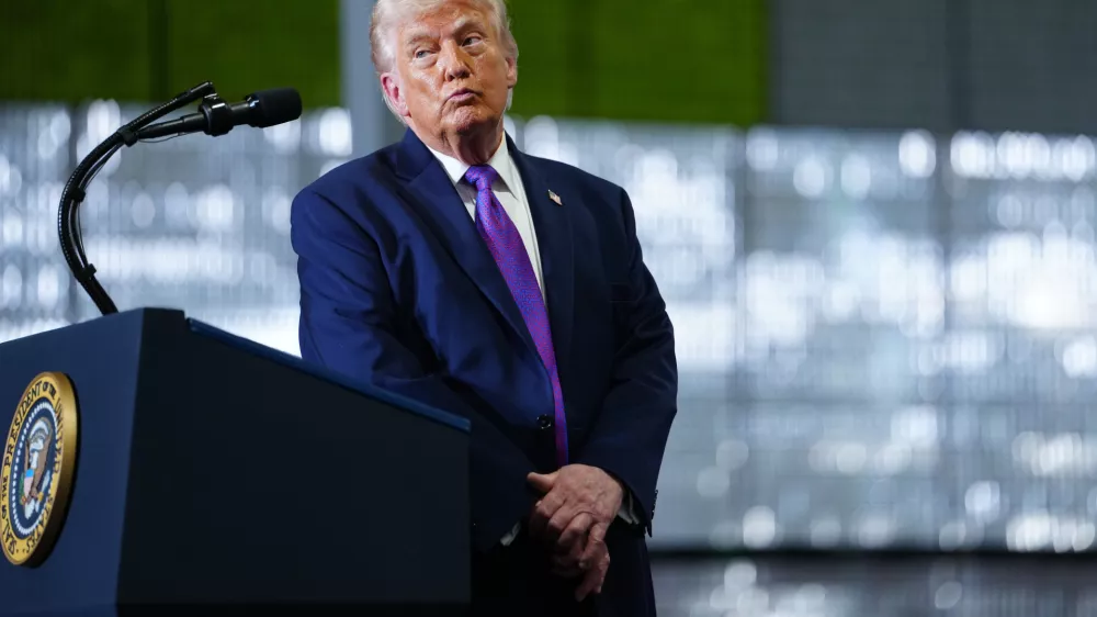 President Donald Trump pauses after a person in the crowd needed medical assistance as he speaks at Verst Logistics Wednesday, March 11, 2026, in Hebron, Ky. (AP Photo/Julia Demaree Nikhinson)
