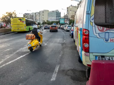 Valletta, Malta Nov 2, 2024 A yellow scooter on the main coastal road in the Sliema district.