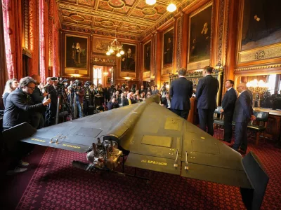 An Iranian Shahed-136 attack drone, acquired from Ukraine by United Against Nuclear Iran (UANI), is displayed at a press conference in Parliament in London, Tuesday, Oct. 14, 2025. (AP Photo/Kin Cheung)