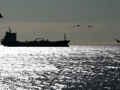 The silhouette of the oil and chemical tanker Habip Bayrak sails off the Gulf of Fos-sur-Mer, in Port-de-Bouc, France, March 12, 2026. REUTERS/Manon Cruz