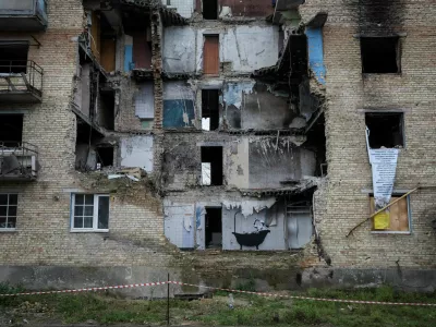 FILE PHOTO: A new graffiti in Banksy's signature style, although not posted by the mercurial artist on social media, is seen on the wall of a destroyed building in the Ukrainian village of Horenka, which had been occupied by Russia until April and heavily damaged by fighting in the early days of Russian invasion, November 13, 2022. REUTERS/Gleb Garanich