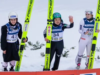 From left, second placed Japan's Yuki Ito, first placed Japan's Nozomi Maruyama and third placed Norway's Anna Odine Strom celebrate after the the women's large hill ski jumping competition at the World Cup in Holmenkollen, Norway, Sunday, March 15, 2026. (Christoffer Andersen/NTB via AP)