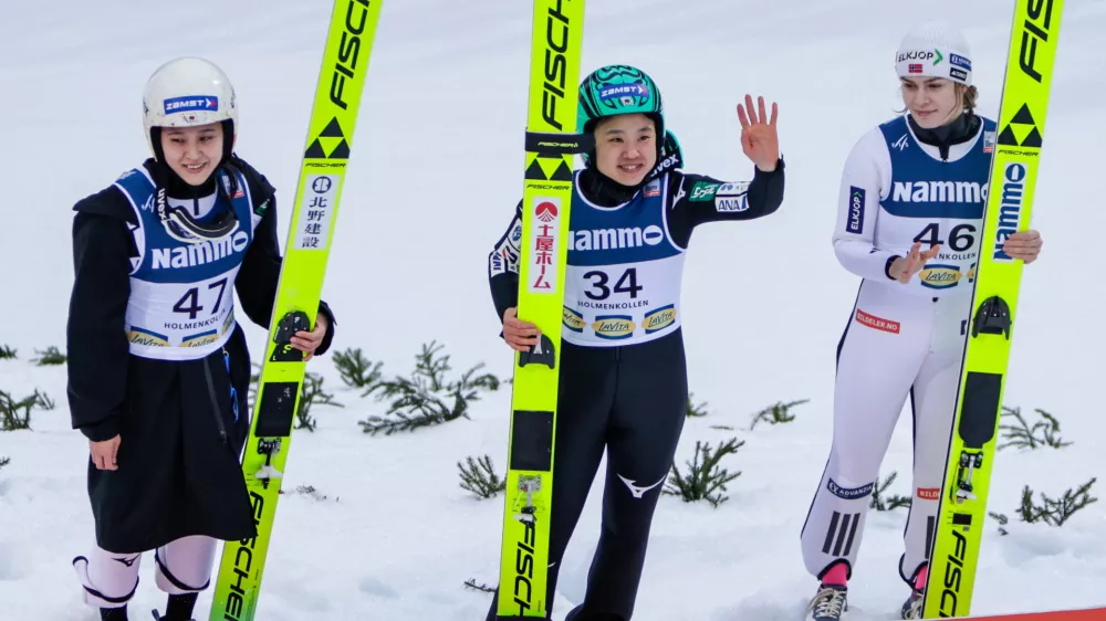 From left, second placed Japan's Yuki Ito, first placed Japan's Nozomi Maruyama and third placed Norway's Anna Odine Strom celebrate after the the women's large hill ski jumping competition at the World Cup in Holmenkollen, Norway, Sunday, March 15, 2026. (Christoffer Andersen/NTB via AP)
