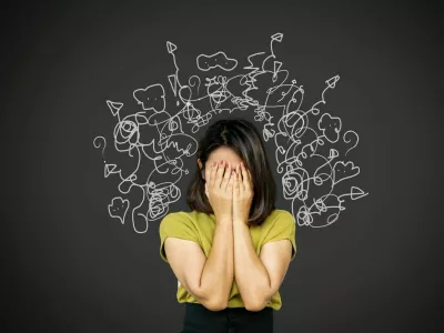 depressed Asian woman in deep many thoughts, having problem with over thinking