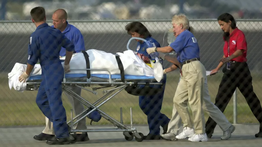 Actor Jason Priestley is removed from the infield hospital to an awaiting helicopter after crashing his Infinity Pro Series car during a practice session for the Kentucky 100, Sunday, Aug. 11, 2002, at the Kentucky Speedway in Sparta, Ky. IRL officials describes his injuries as serious. Priestley, a former star of the "Beverly Hills 90210" television series, was flown by helicopter to the University of Kentucky Medical Center in Lexington. (AP Photo/Ed Reinke)