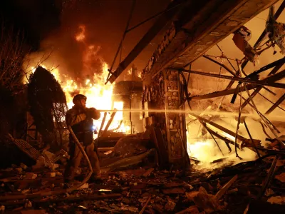 Firefighters try to put out a fire at a private house following a Russian drone attack in Zaporizhzhia, Ukraine, Monday, March 16, 2026. (AP Photo/Kateryna Klochko)