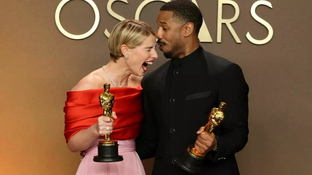 Jessie Buckley, winner of the Oscar for Best Actress for "Hamnet, and Michael B. Jordan,winner of the Oscar for Best Actor for "Sinners", pose together in the Oscars photo room at the 98th Academy Awards in Hollywood, Los Angeles, California, U.S., March 15, 2026. REUTERS/Mario Anzuoni   TPX IMAGES OF THE DAY